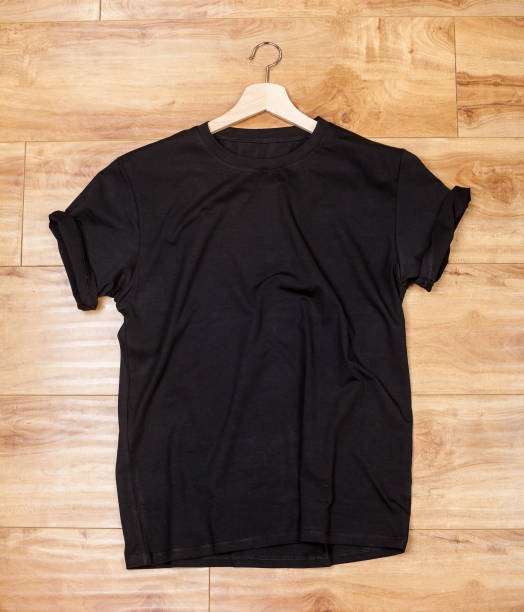 istock Black shortsleeve cotton tshirt on a wooden backgronud 922855116