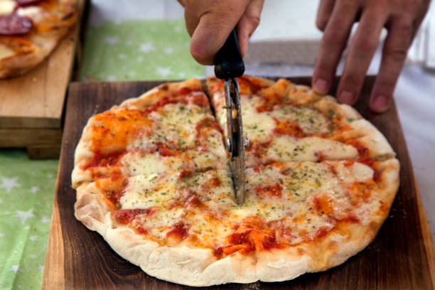 istock Pizza on wooden background 922855126