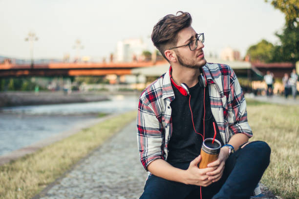 istock Man with headset relax outdoor. 922857602