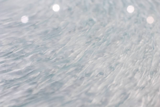 istock circular wave motion in a fluid system. blue gray background for a liquid pushed into a circular motion. 922862348