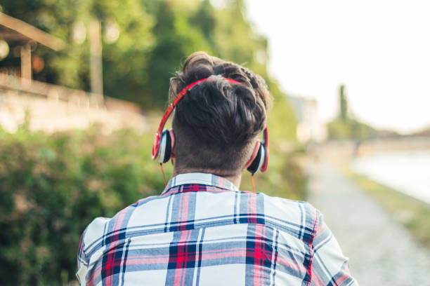 istock Man listening music on headset. 922867510