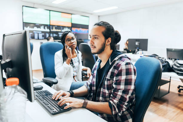 istock Business colleagues discussing at desk in creative office 922871952