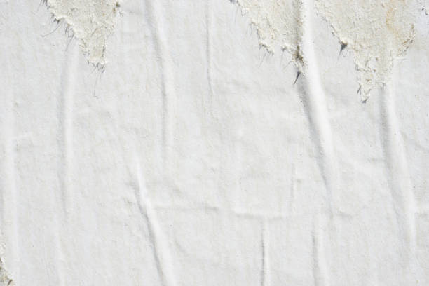 istock Blank old ripped torn crumpled creased posters grunge textures backdrop backgrounds 922872196