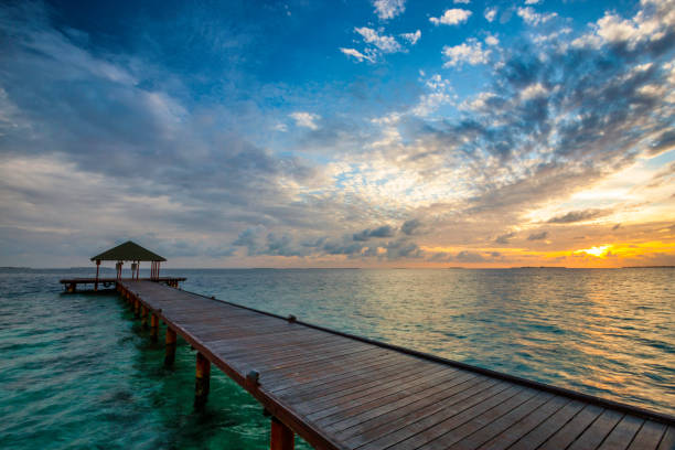 istock Maldives Pier Spectacular Sunrise 922872538