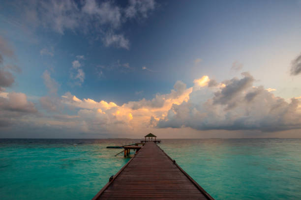 istock Maldives Pier Spectacular Sunrise 922872596