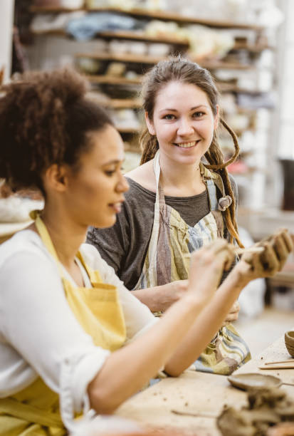 istock Young Women Creating Pottery in an Art Studio 922873178