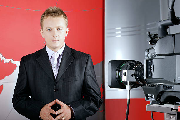 Real Romanian television presenter in front of the video camera stock photo
