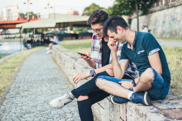 istock Two friends watch funny things on a mobile phone. 922875662