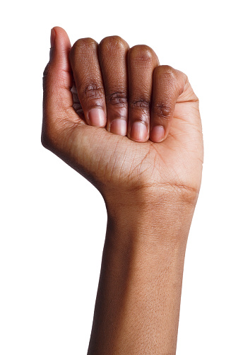 Female black fist isolated on white background. African-american clenched hand, gesturing up. Counting, aggression, brave concept
