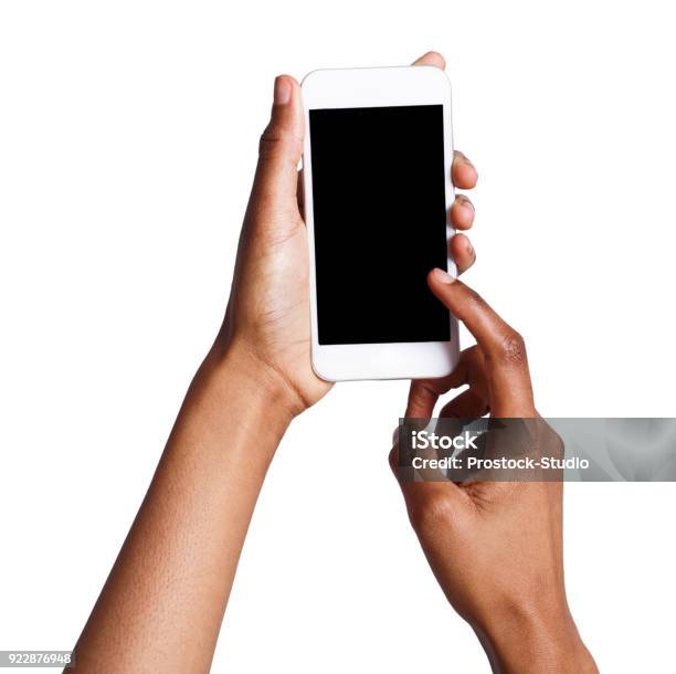 Female Hands Pointing On Blank Mobile Phone Screen Stock Photo - Download Image Now - Telephone, Hand, Mobile Phone