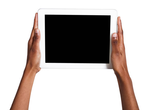 Man holding tablet with white blank screen isolated on white background with clipping path cut out.