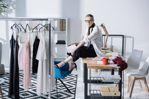 istock attractive young fashion designer sitting on work desk 922879566