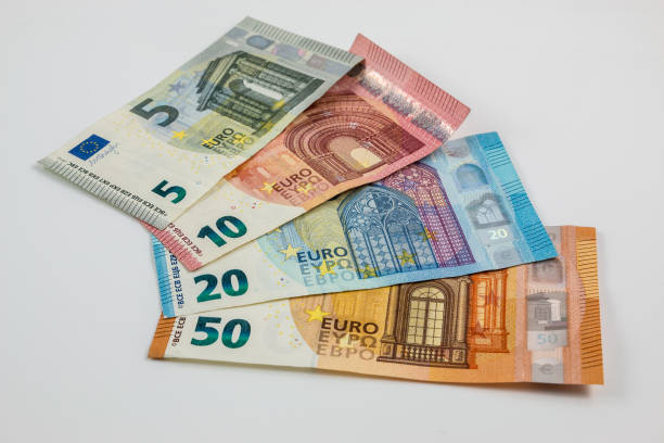 istock Euro banknotes and white background 922880316
