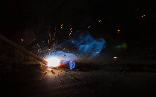 SMAW – Shielded metal arc welding. SMAW – Shielded metal arc welding and welding flame at spark  point. oxyacetylene stock pictures, royalty-free photos & images