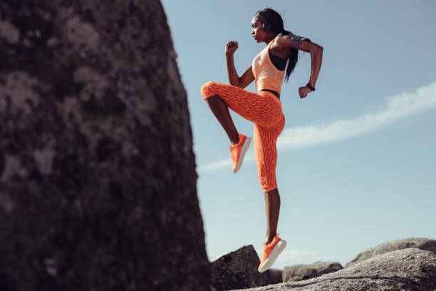 istock Woman doing warm up exercises outdoors 922883680