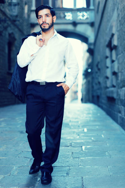 istock Man walking along old town street 922883734