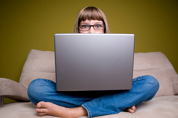 istock Young girl relaxing with laptop 92288509
