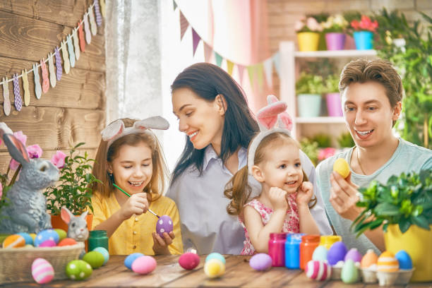 istock family are painting eggs 922887362