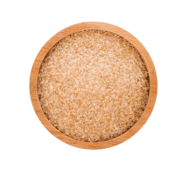 istock Brown sugar in wooden bowl on white background 922887456