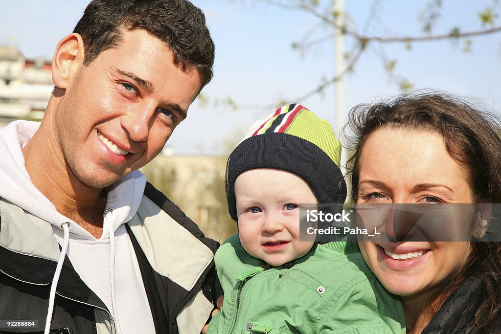 Família com o bebê rostos - Foto de stock de Adolescente royalty-free