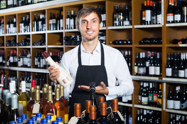 istock male seller in wine store 922890644