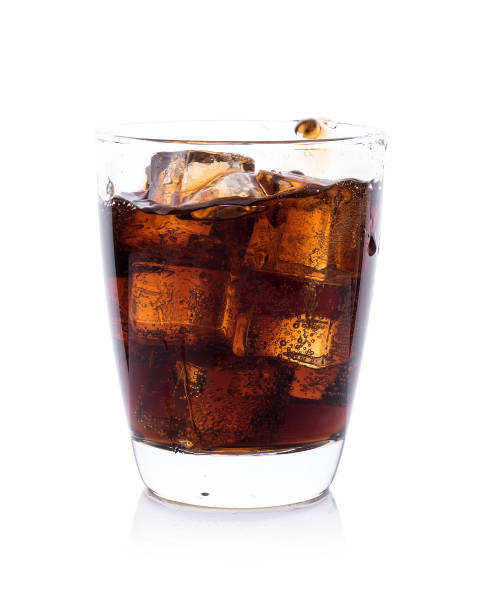 istock Cola in glass with ice cubes on white background 922891178