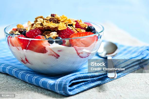 Bowl Of Yogurt Granola And Fruit On A Checkered Tablecloth Stock Photo - Download Image Now