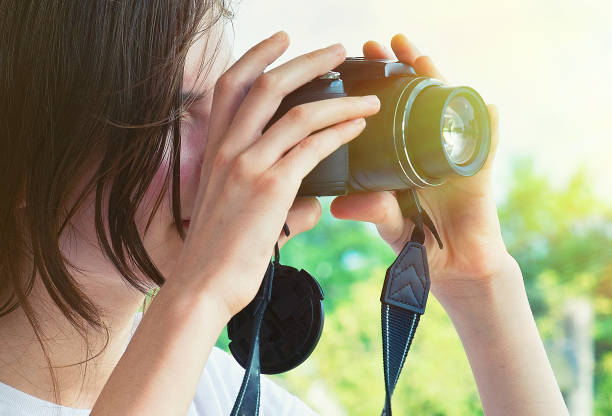 istock Young Girl Taking Photos 922901268