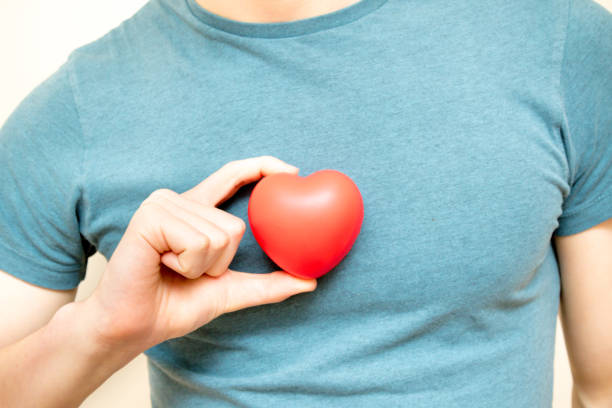 istock Holding a red heart for love 922901428