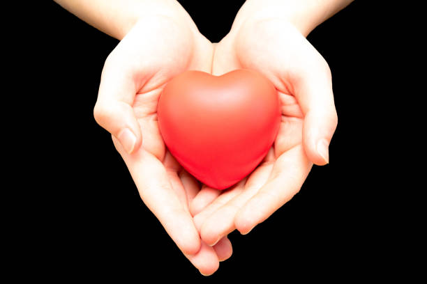 istock Holding a red heart for love 922901568
