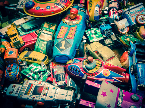 lots of vintage toys on a wooden floor
