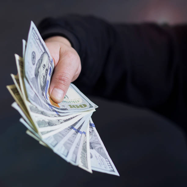 istock Hand on cash. Finance. Corruption. Illegal transactions. 922912378