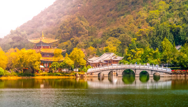 istock Suocui Bridge over Black Dragon Pool at Moon Embracing Pavilion in Jade Spring Park, Lijiang, China 922912640