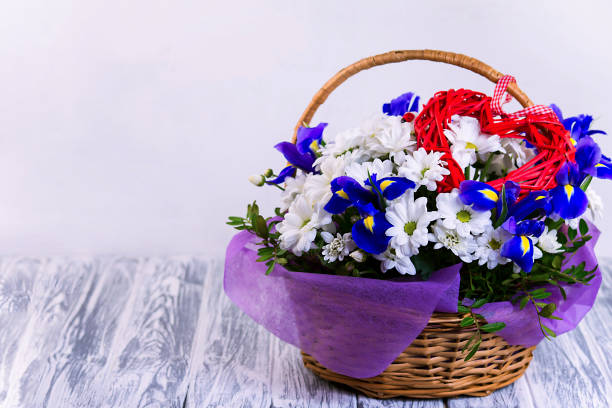 beautiful bouquet of flowers in a wooden shopping basket for a holiday
