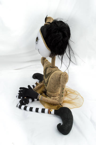 istock Creepy steampunk doll sitting, kneeling, looking left. Vertical. 922918466