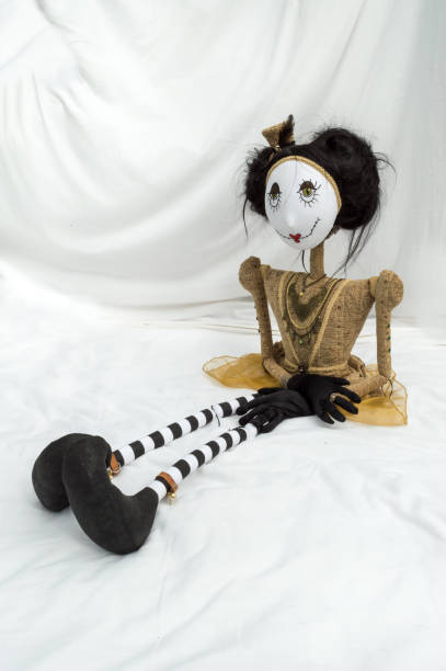 istock Creepy steampunk doll sitting with legs outstretched. Vertical. 922918754