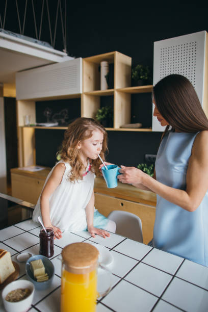 istock Mother and daughter making breakfast 922922266