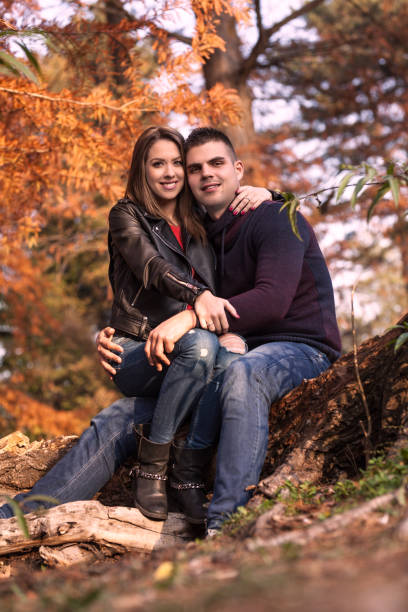 istock Lovely couple enjoying fall in love at park 922922890