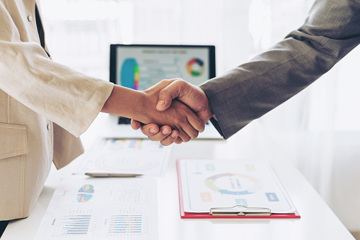 close up hand of business  people shaking hands finishing up meeting showing unity , business teamwork concept