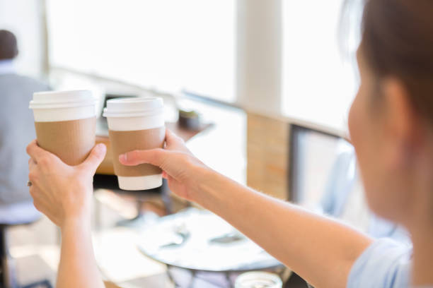 istock Barista hands coffee to customer 922939800