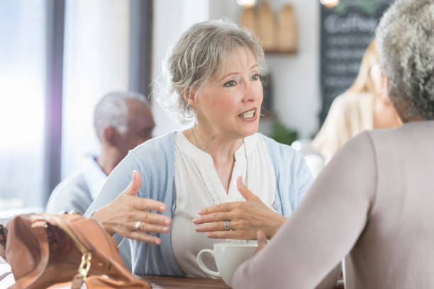 istock Concerned senior woman has conversation with friend 922939858