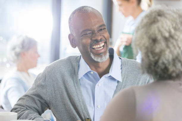 istock Attentive senior man enjoys coffee with is wife 922939870