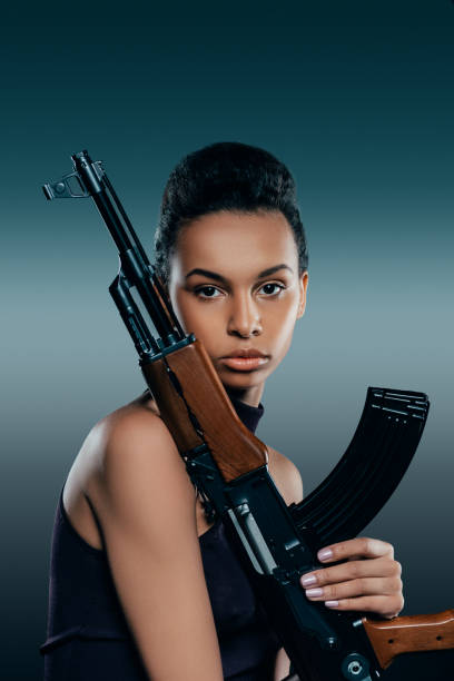 istock african american girl with rifle 922942910