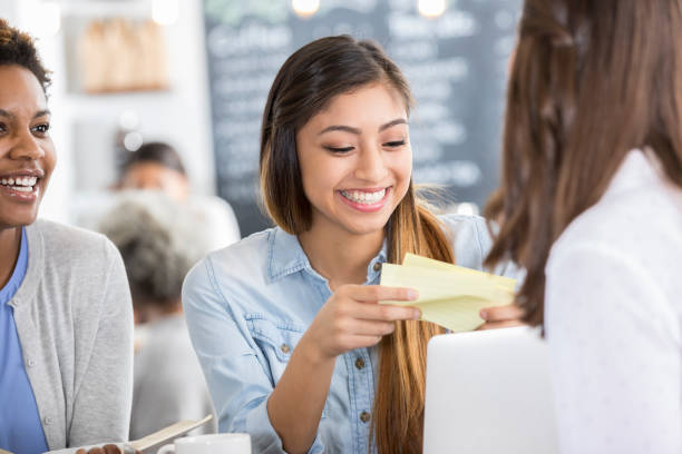 istock Young college women study together for exam 922943590