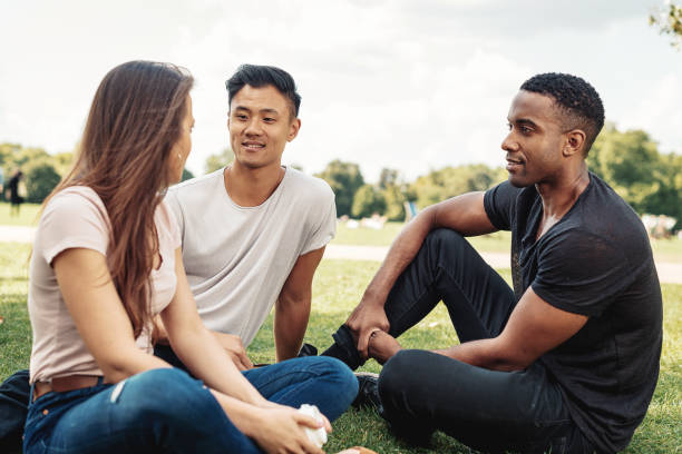 istock International group of people relaxing in park 922949676