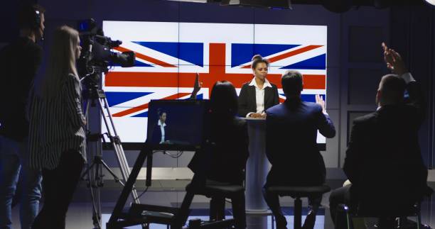 istock Production team assisting a news anchor 922949920