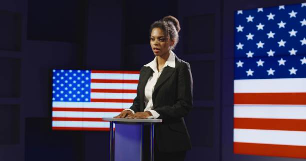 istock Female black speaker giving announcement 922950142