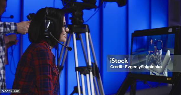 Woman Giving Instructions In A Newsroom Stock Photo - Download Image Now - Movie, Producer, Industry