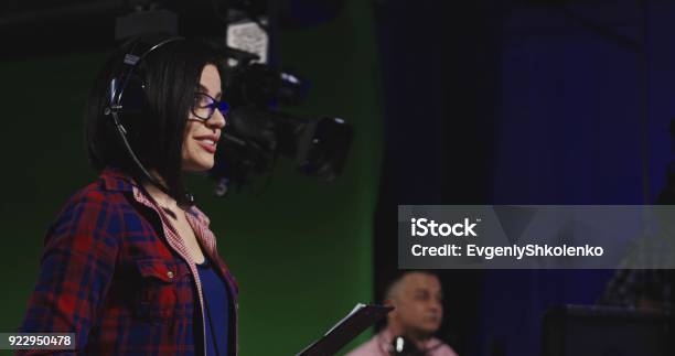 Cheerful Female Stage Manager In Work Stock Photo - Download Image Now - Television Industry, Crew, Industry