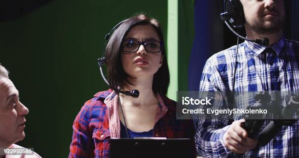 Female Producer Or Prompt Wearing A Headset Stock Photo - Download Image Now - Producer, Television Set, Television Industry